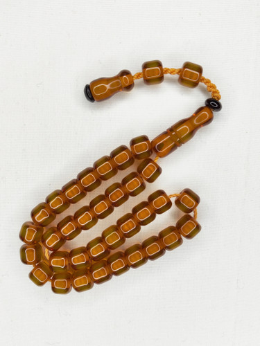 تسبیح کهربا آب حیات 33عددی شفاف رنگ نباتی تراش قیچی بر (کسمه) دنباله دار
